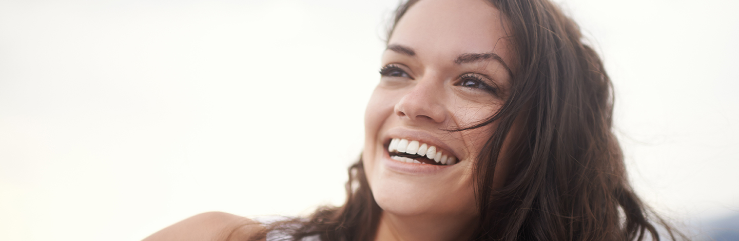 Smiling young woman at beach