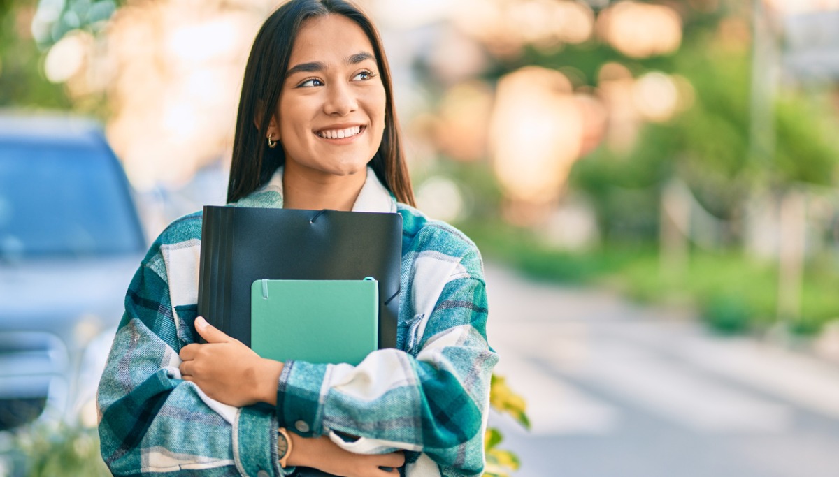 student with folders-1200x683.jpg