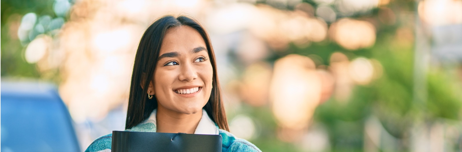 student with folders-1600x529.jpg